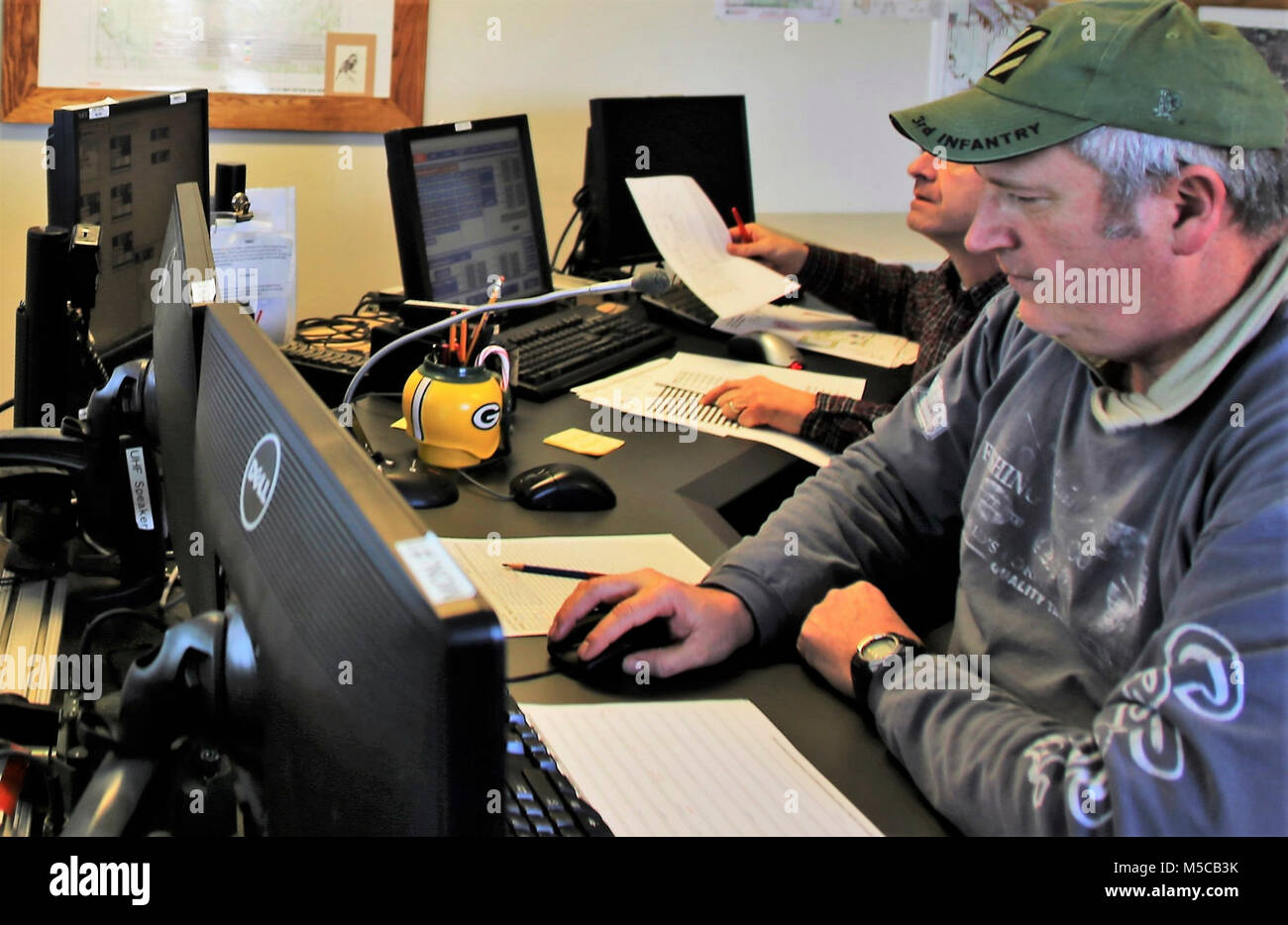 Range Control Technician Mark Confer with the Directorate of Plans, Training, Mobilization and Security works at the Fire Desk on Jan. 16, 2018, at Fort McCoy, Wis. The desk operates communications with units using the range complex as well as Range Maintenance and other personnel throughout 46,000 acres of training areas on Fort McCoy. (U.S. Army Stock Photo