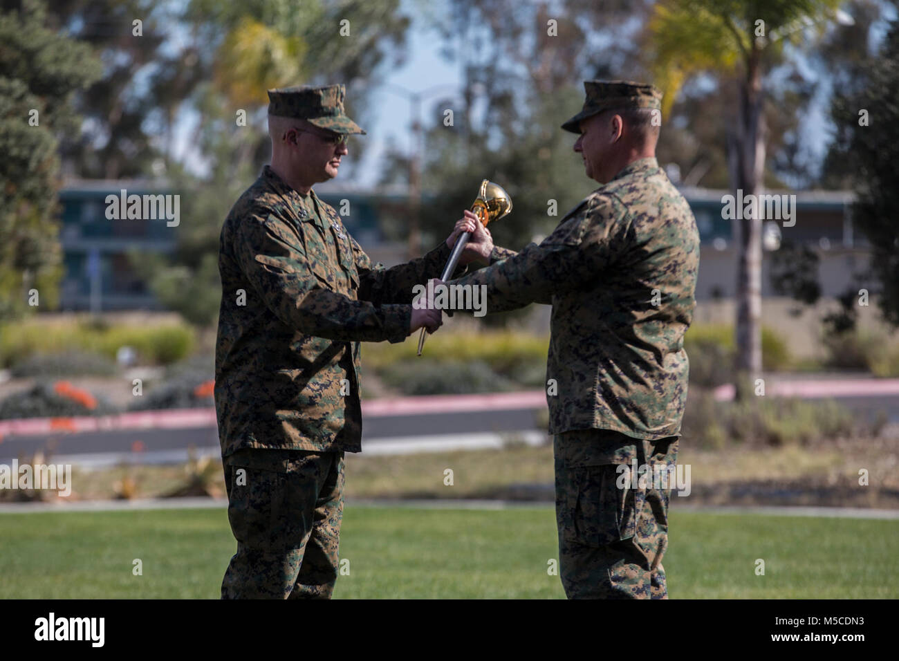 U.S. Marine Brig. Gen. Stephen Sklenka, the commanding general for the 1st Marine Logistics Group, passed the petty officer’s cutlass to Master Chief Petty Officer Zachary Pryor, command master chief for the 1st MLG, during his appointment ceremony at Camp Pendleton, Calif., Feb. 13, 2018. The last U.S. Navy cutlass manufactured was the Model 1917, made in 1917, until they were declared obsolete in 1949. (U.S. Marine Corps Stock Photo
