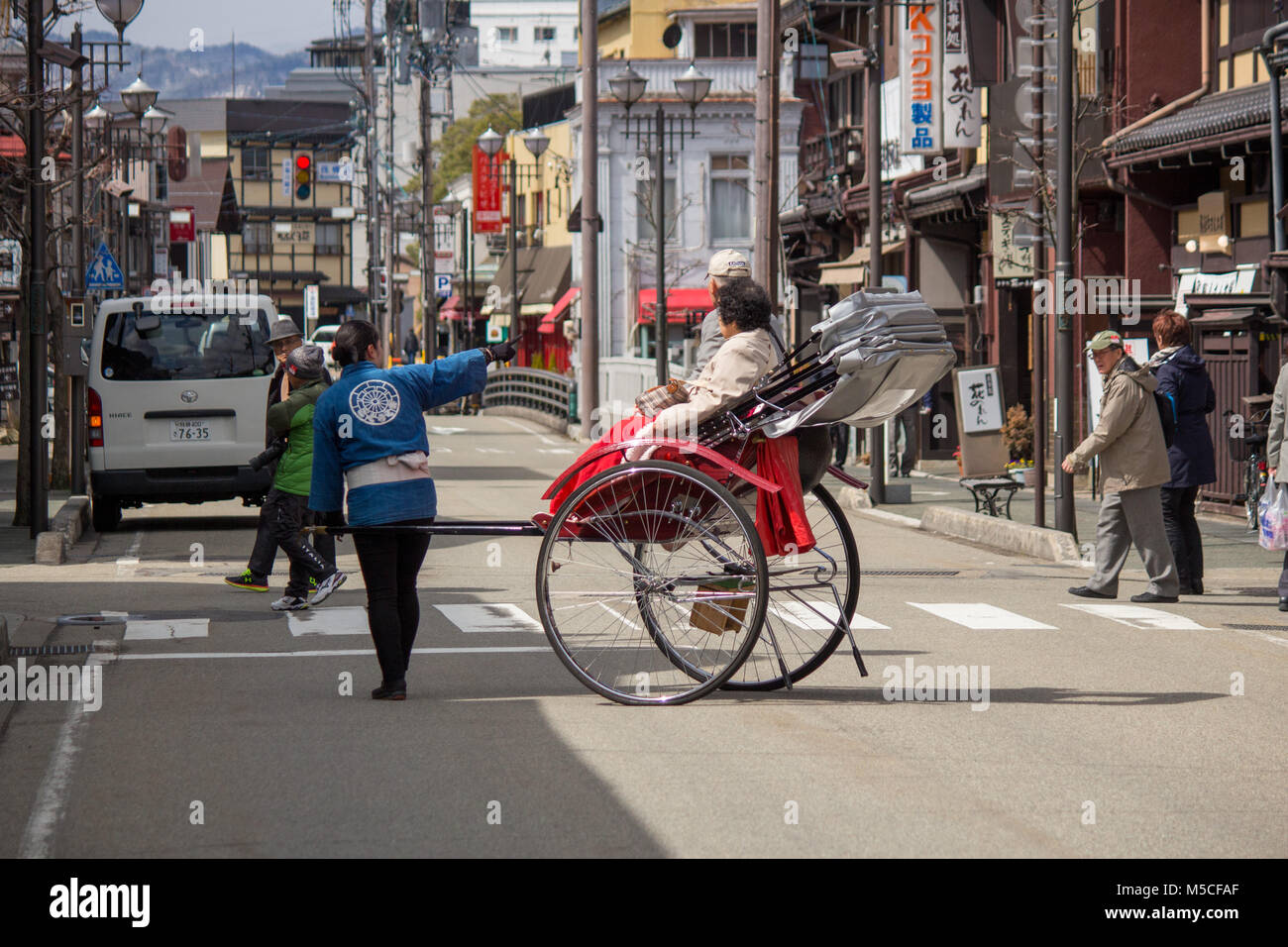 A Rickshaw ride in Takayama. Takayama is a city in Japan's mountainous Gifu Prefecture Stock Photo