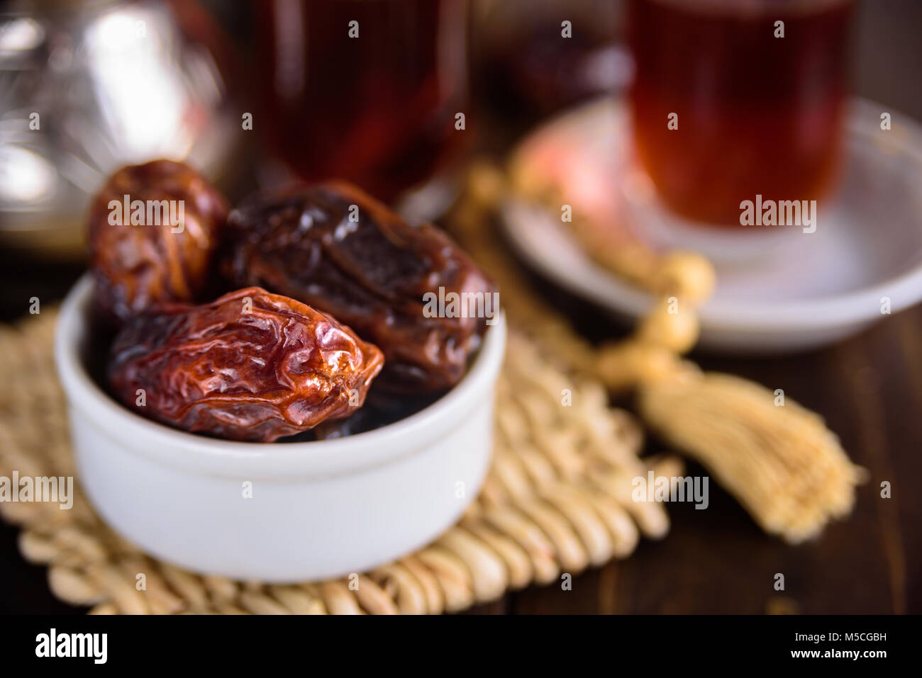 Date friuts and tea for iftar. Prayer beads Stock Photo