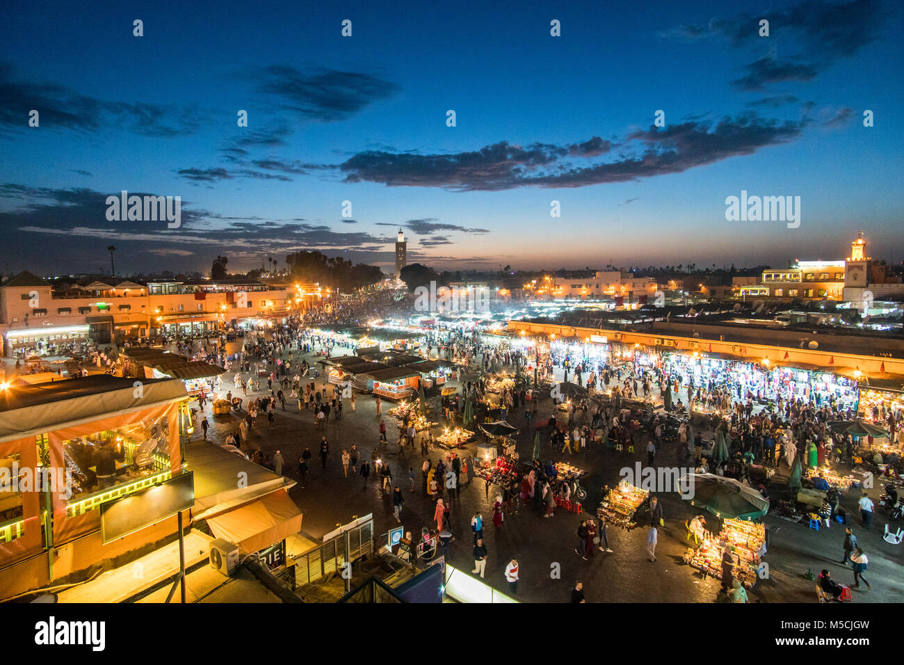 Famous Moroccan market square Jamaa el Fna in Marrakesh medina quarter, called also Jemaa el-Fnaa, Djema el-Fna or Djemaa el-Fnaa, full of tourists an Stock Photo