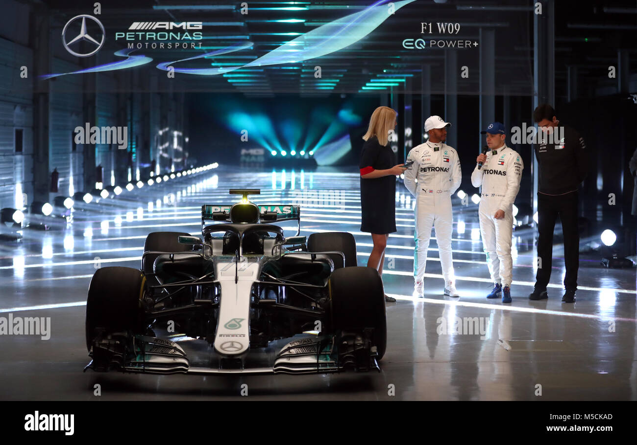 Mercedes Lewis Hamilton and Valtteri Bottas (second right) alongside team principal Toto Wolff (right) as the new Mercedes W09 EQ Power+ is revealed during the Mercedes-AMG F1 2018 car launch at Silverstone, Towcester. Lewis Hamilton and team principal Toto Wolff (right) next to the new Mercedes W09 EQ Power+ during the Mercedes-AMG F1 2018 car launch at Silverstone, Towcester. Stock Photo