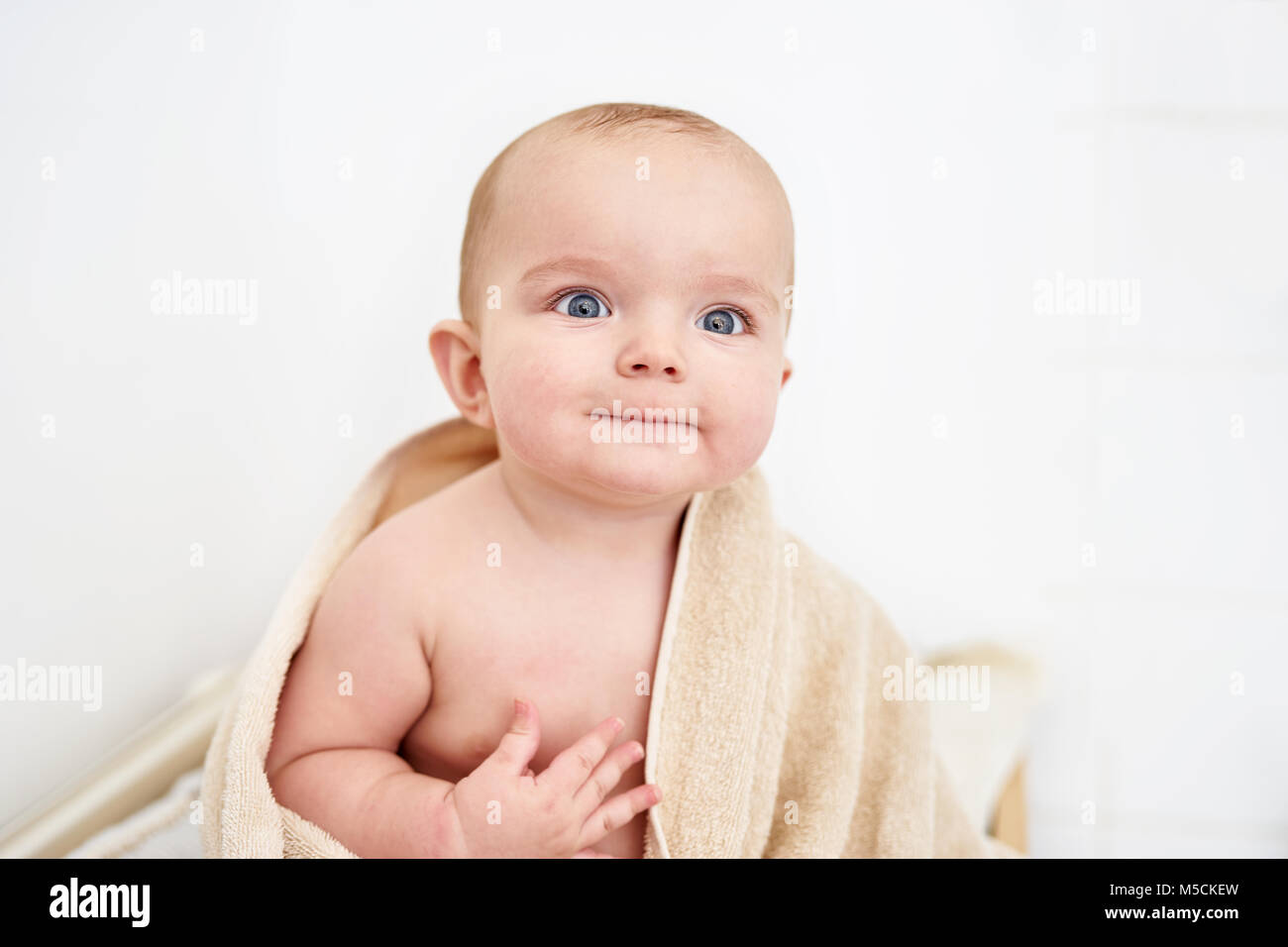 Beautiful baby boy model sitting after bathing Stock Photo Alamy