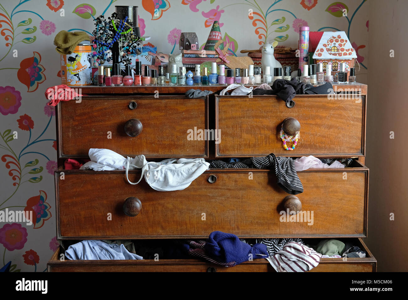 A teenage daughters messy bedroom Stock Photo