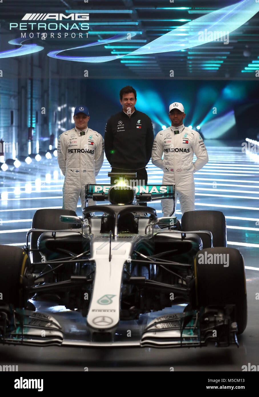 Mercedes Lewis Hamilton (right) and Valtteri Bottas (left) alongside team principal Toto Wolff as they pose for a picture with the new Mercedes W09 EQ Power+ during the Mercedes-AMG F1 2018 car launch at Silverstone, Towcester. Stock Photo