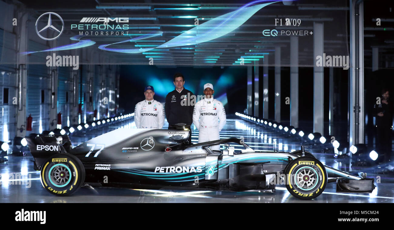 Mercedes Lewis Hamilton (right) and Valtteri Bottas (left) alongside team principal Toto Wolff as they pose for a picture with the new Mercedes W09 EQ Power+ during the Mercedes-AMG F1 2018 car launch at Silverstone, Towcester. Stock Photo