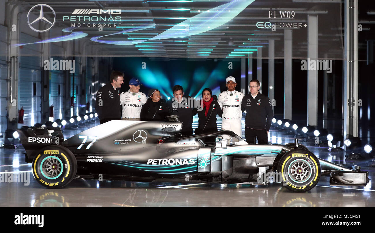 Mercedes Lewis Hamilton (second right), Valtteri Bottas (second left) and team principal Toto Wolff (centre) as they pose for a picture with the new Mercedes W09 EQ Power+ during the Mercedes-AMG F1 2018 car launch at Silverstone, Towcester. Stock Photo