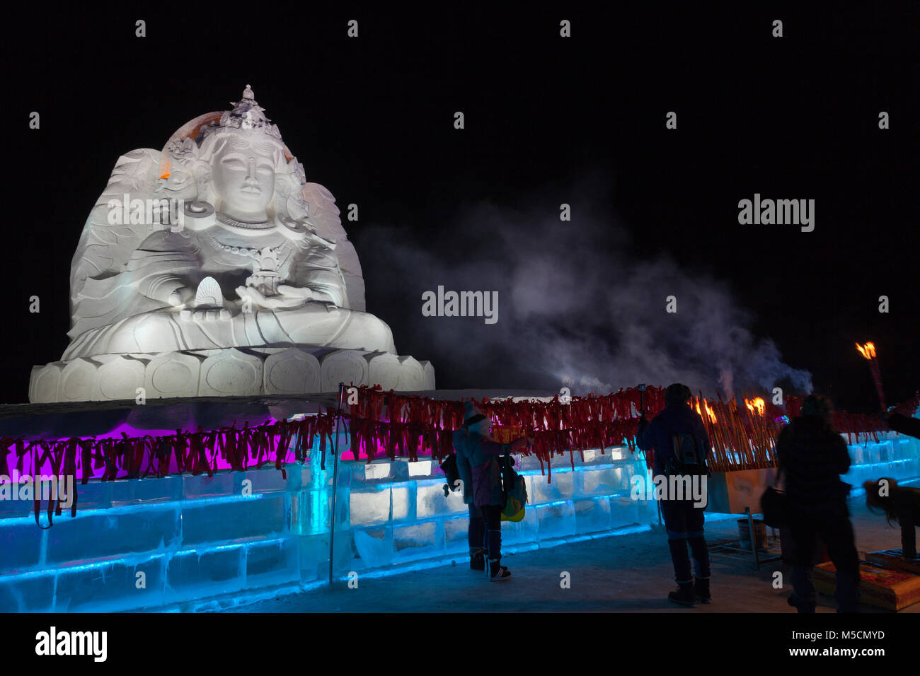Night scenes from the Harbin Ice Festival, Heilongjiang, China. Ice sculpture of the Chinese Goddess of Mercy, Guanyin. Stock Photo