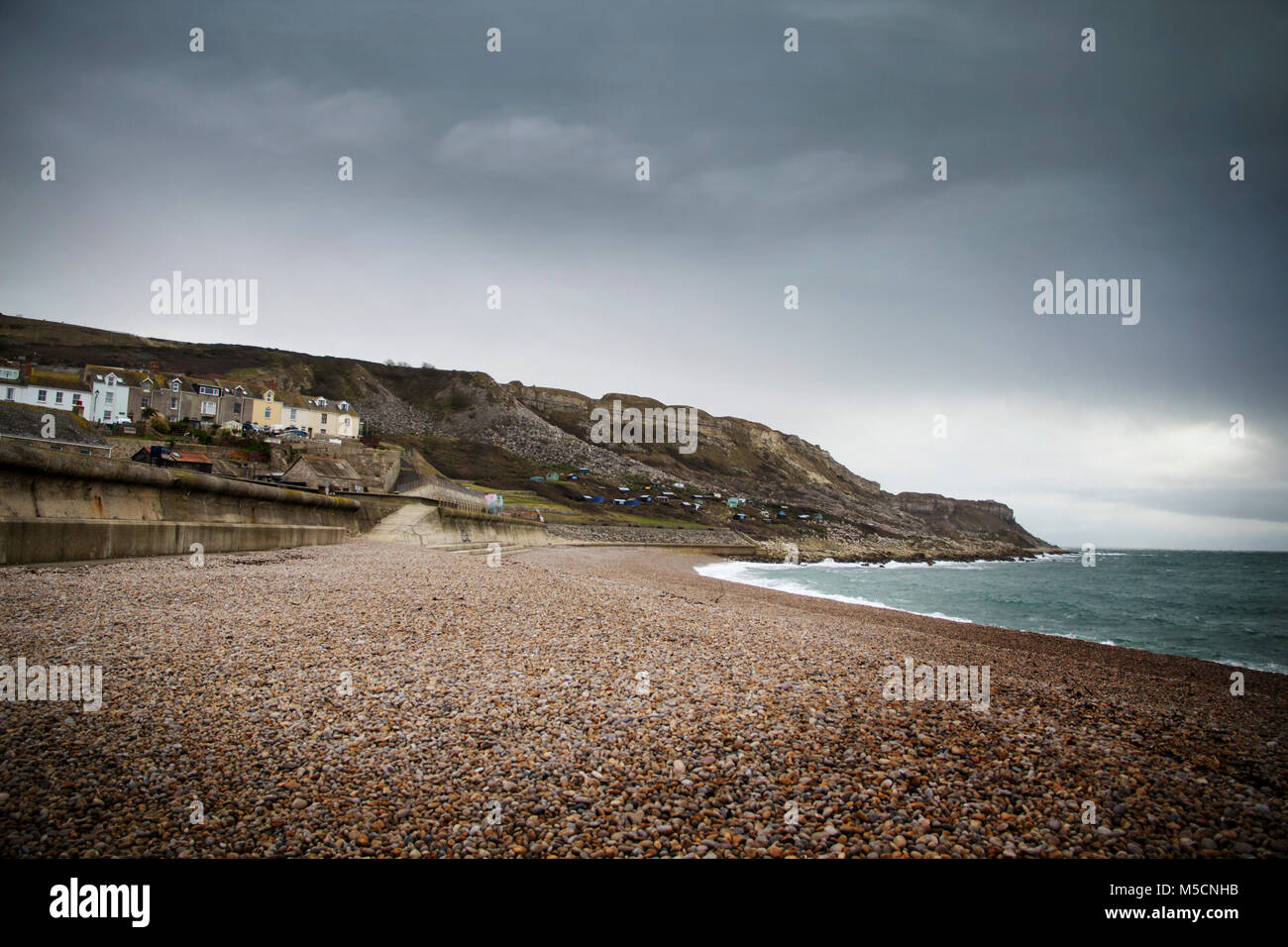 WEYMOUTH, DORSET, UK - DECEMBER 26. 2017. Dark skies over Chesil famous for its pebble beach in Weymouth, a coastal town in the county of Dorset, Engl Stock Photo