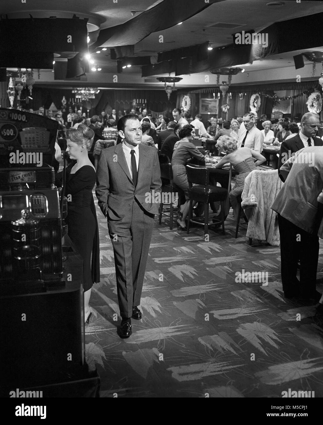 Frank Sinatra walking the casino floor in the movie Ocean’s Eleven, 1960. Image from negative. Stock Photo
