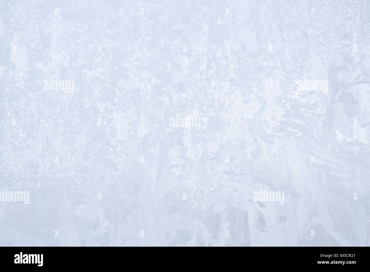 Winter frosty patterns on the frozen ice window Stock Photo - Alamy