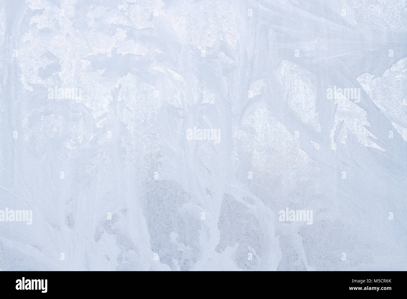 Winter frosty patterns on the frozen ice window Stock Photo - Alamy