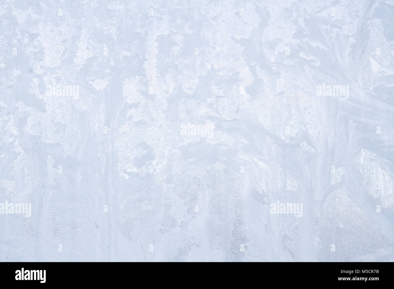 Winter frosty patterns on the frozen ice window Stock Photo - Alamy