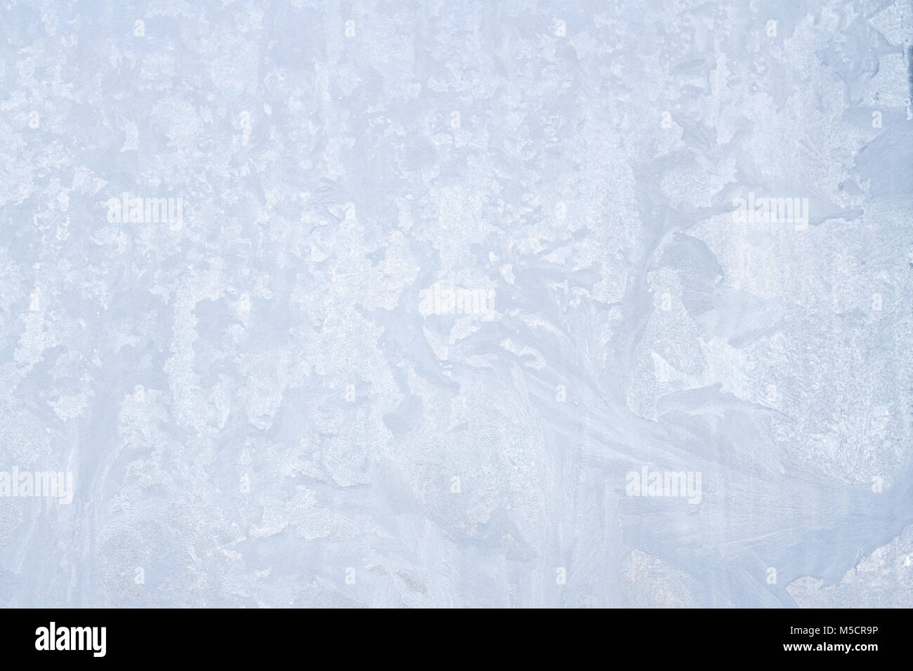 Winter frosty patterns on the frozen ice window Stock Photo - Alamy