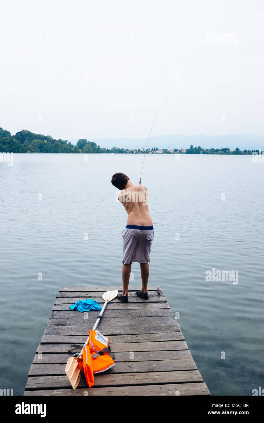 12 year old boy fishing on lake pier Stock Photo - Alamy 12 year old boy fishing on lake pier Stock Photo - Alamy