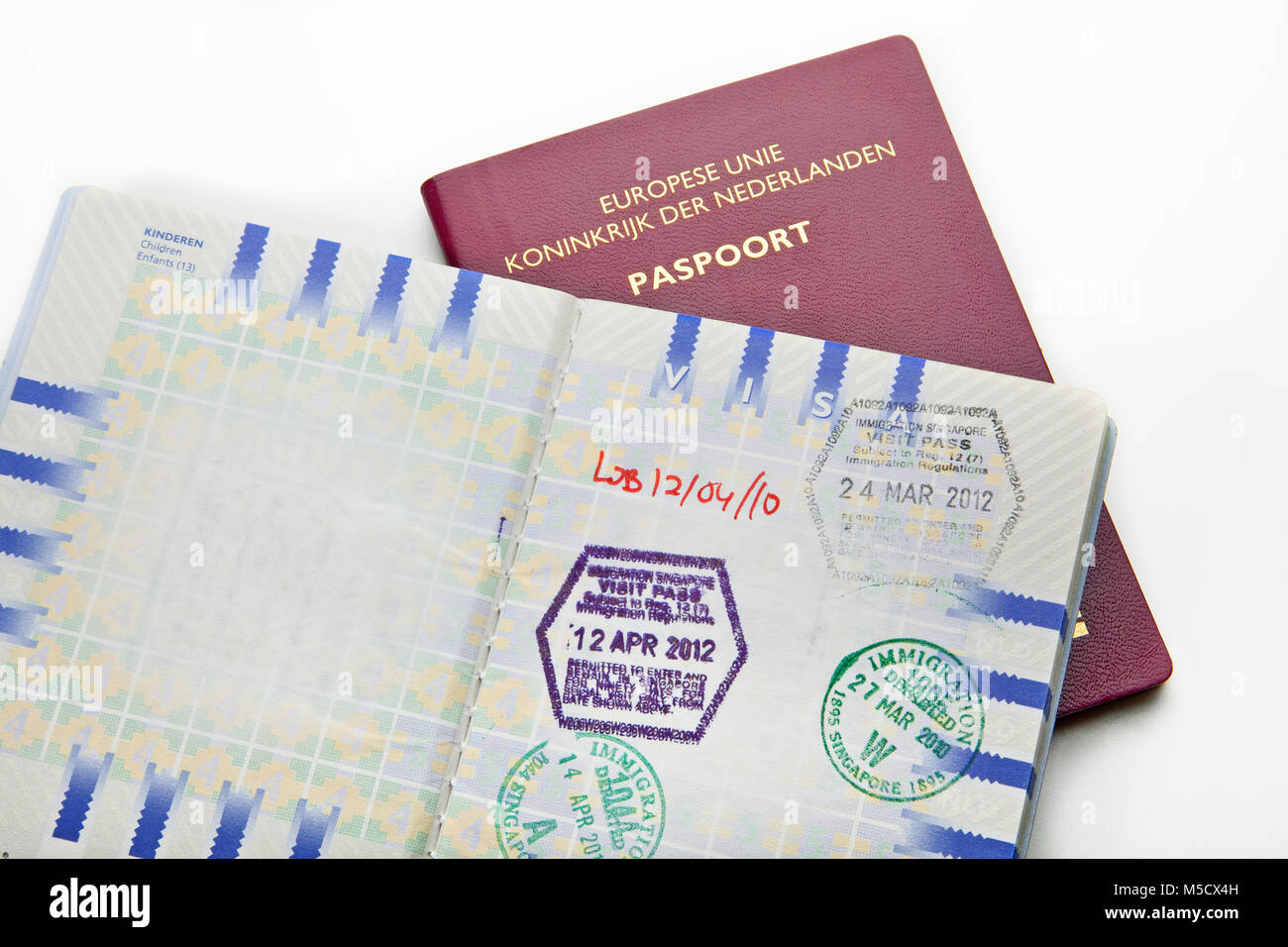 Visa and passport to approved stamped on a document top view in Immigration Stock Photo
