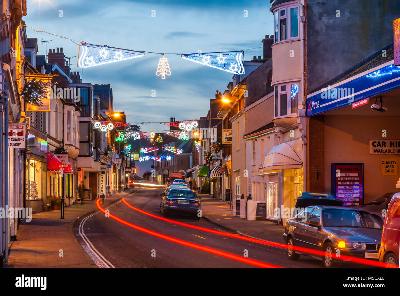 Budleigh High Street with Christmas decorations and car trails. Stock Photo