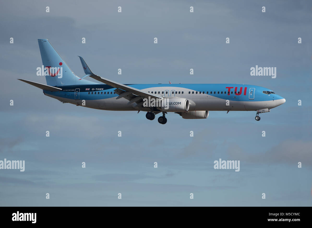 A Boeing 737-800 holiday flight returns to Aberdeen after the passengers had enjoyed a break in the Mediterranean sun. Stock Photo