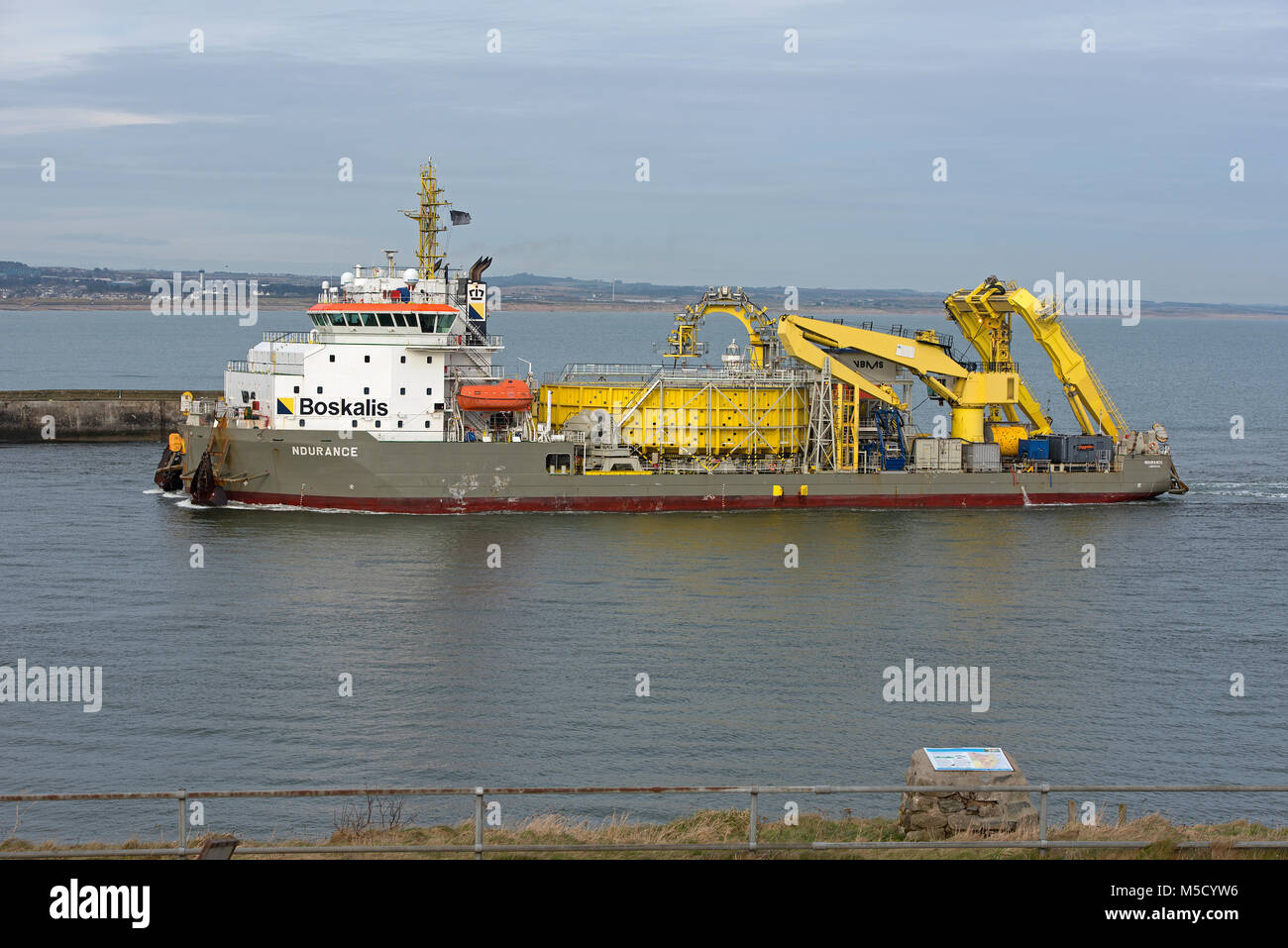 The Boskalis 'Ndurance' dredger and calbe laying vessel on its return to the  Grampian harbour of Aberdeen on the North East Scottish coast. Stock Photo