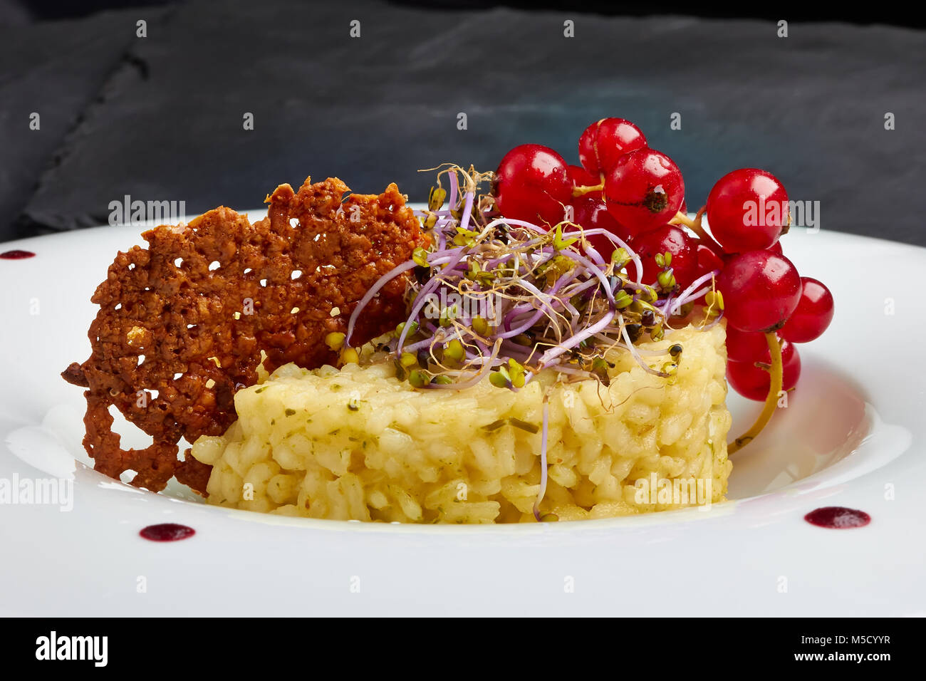 Vegetable risotto and crispy cheese Stock Photo - Alamy