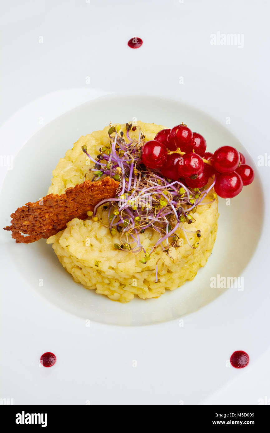 Vegetable risotto and crispy cheese white background Stock Photo - Alamy