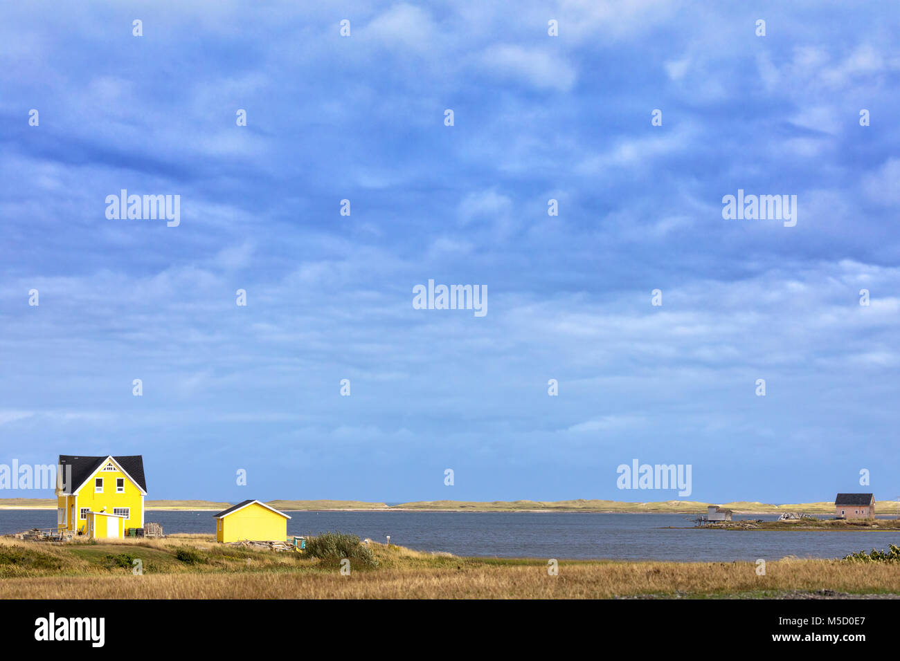 The colourful painted wooden houses of Havre Aubert, Iles de la