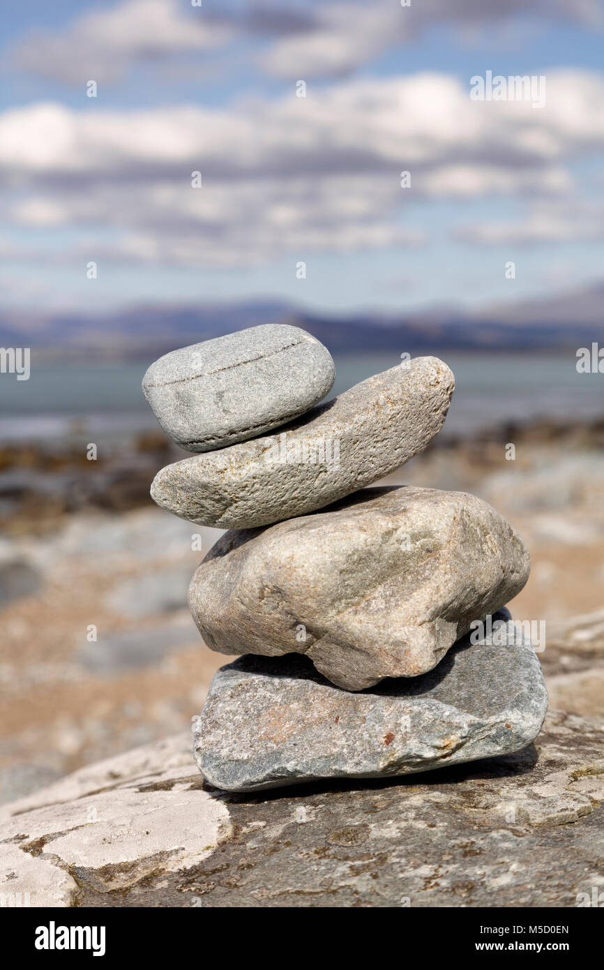 Poise stones Zen pebble sculpture on a beach near Harlech in North Wales Stock Photo