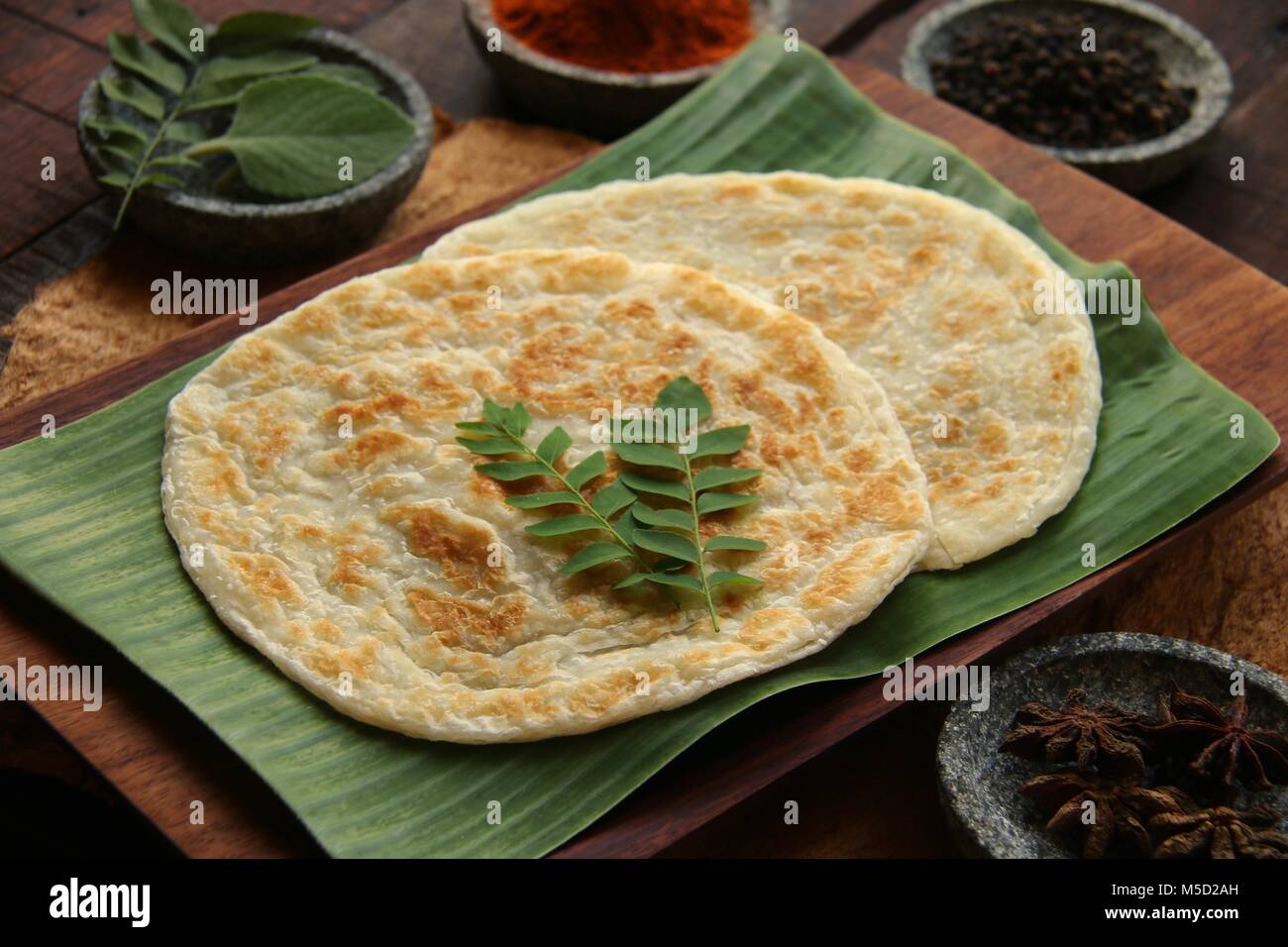 Roti Prata. Indian-influenced dish of flatbread popular in Singapore and Malaysia. Stock Photo