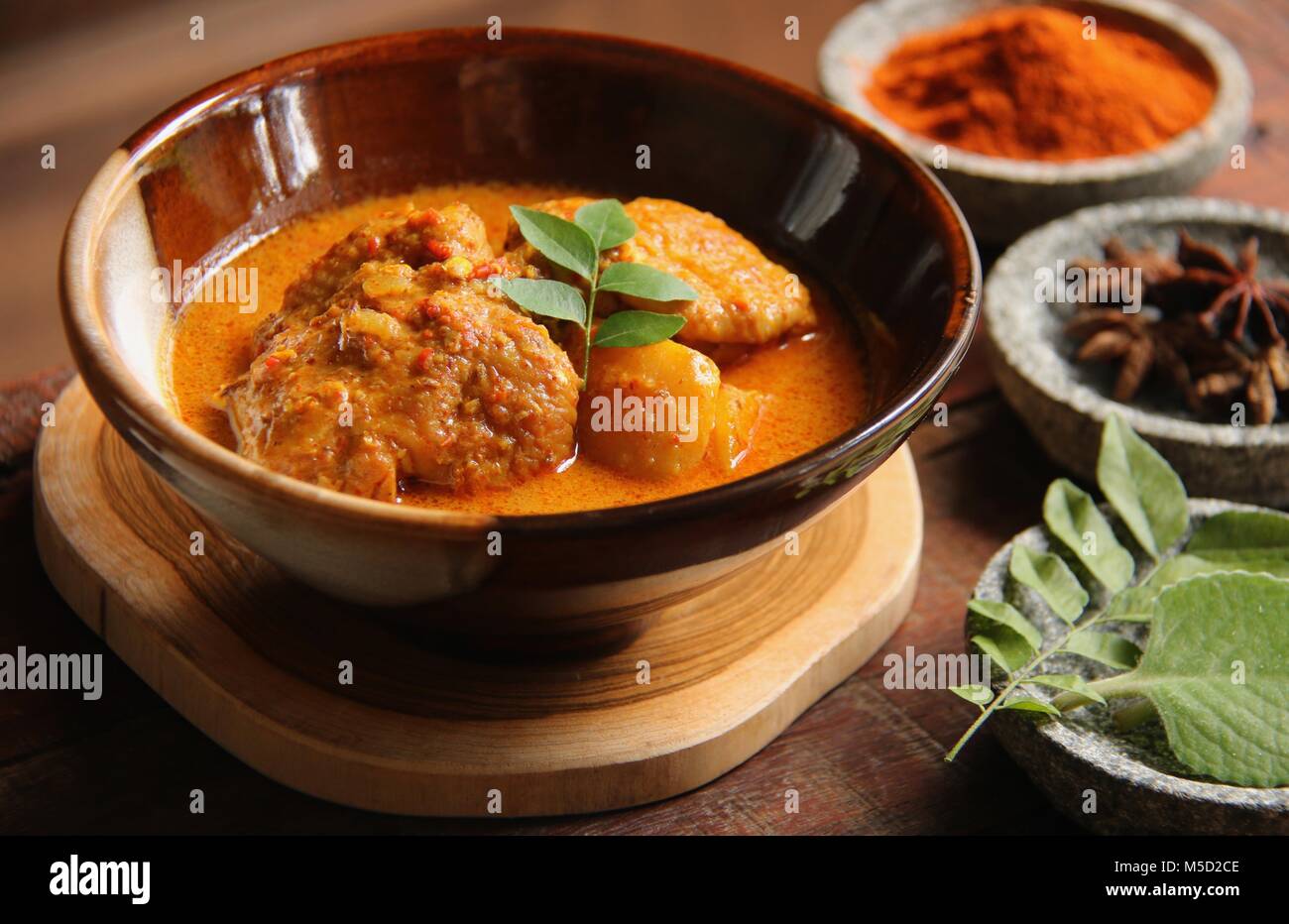 Chicken and Potato Curry. Indianinfluenced dish of chicken and potato