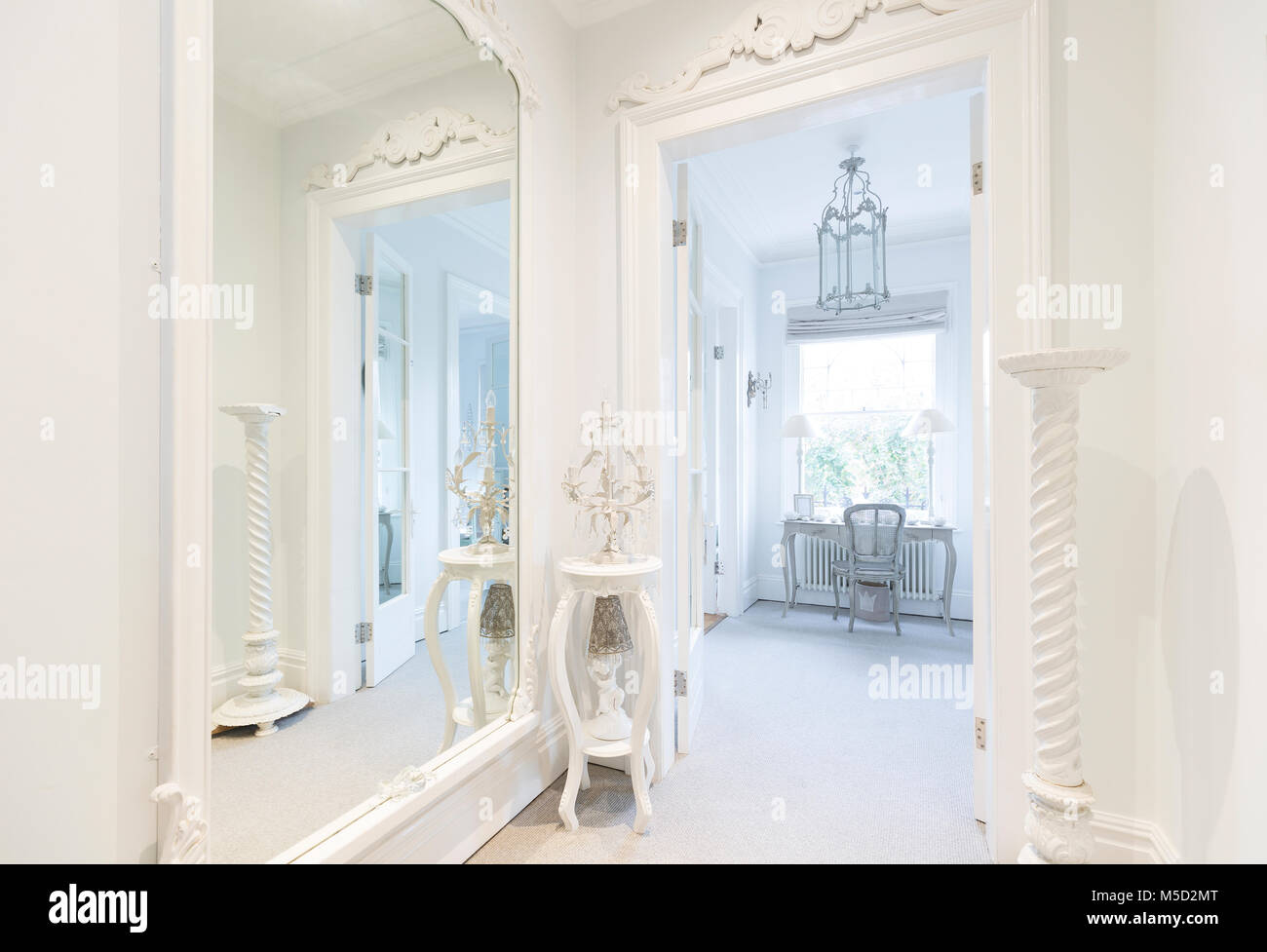 White, luxury home showcase interior corridor with mirror Stock Photo