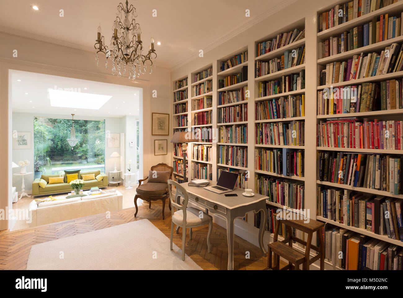 Books on bookshelves in luxury home showcase interior library Stock Photo