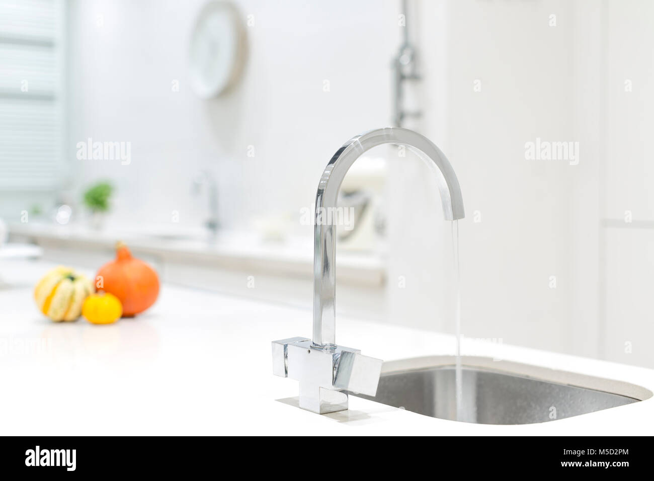 Modern stainless steel kitchen faucet and sink Stock Photo