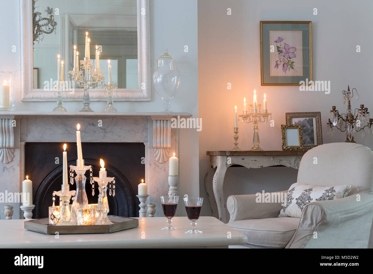 Candlelit luxury home showcase interior living room with fireplace Stock Photo