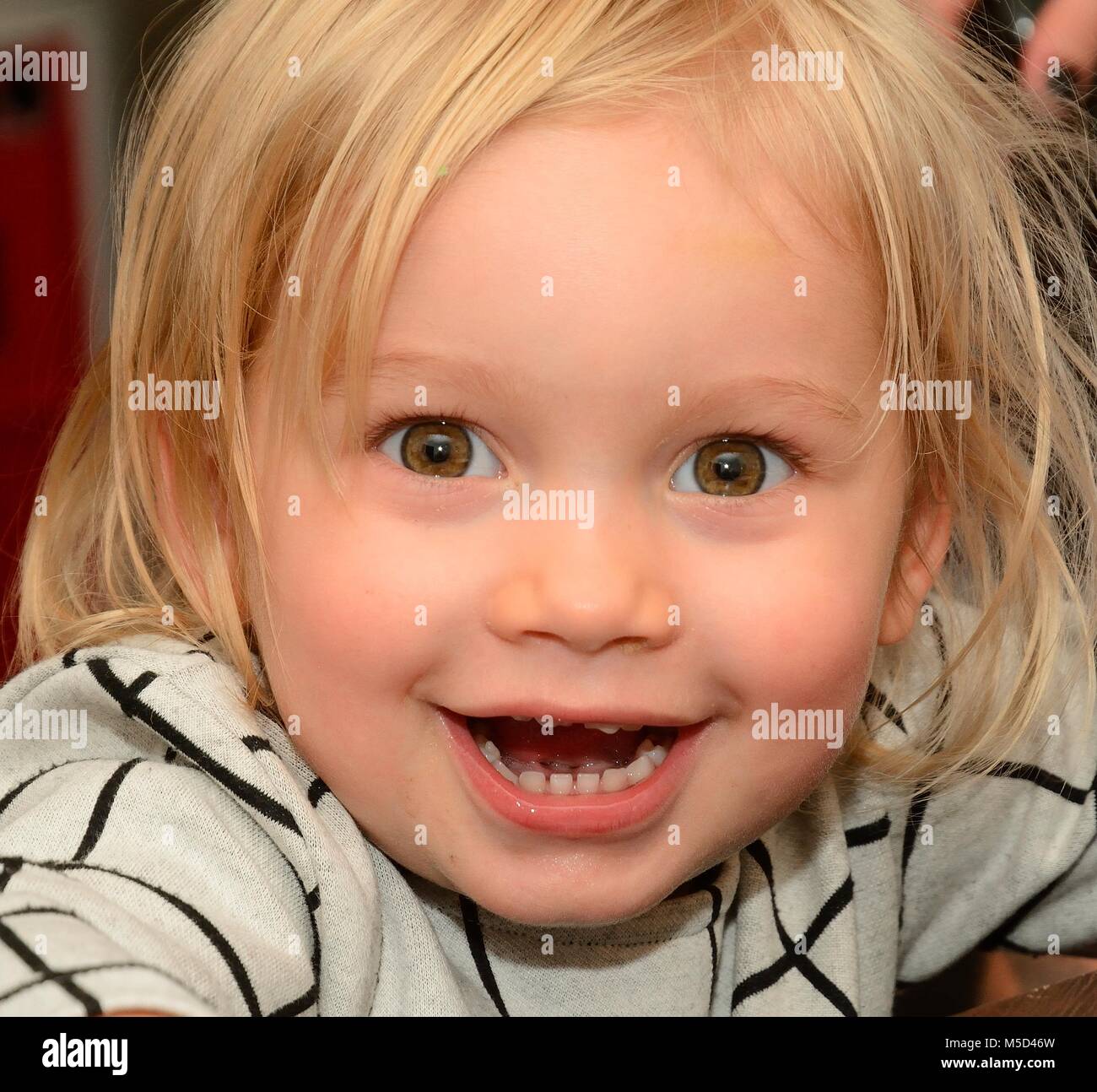 Portrait on a happy blond girl, Ystad, Sweden Stock Photo