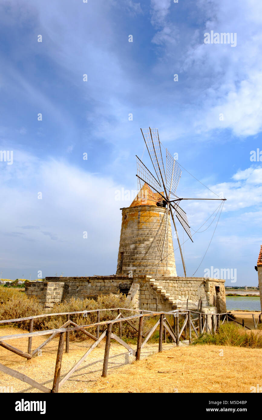 Mulino Maria Stella windmill in front of saltworks, Via del Sale, salt road, province of Trapani, Sicily, Italy Stock Photo