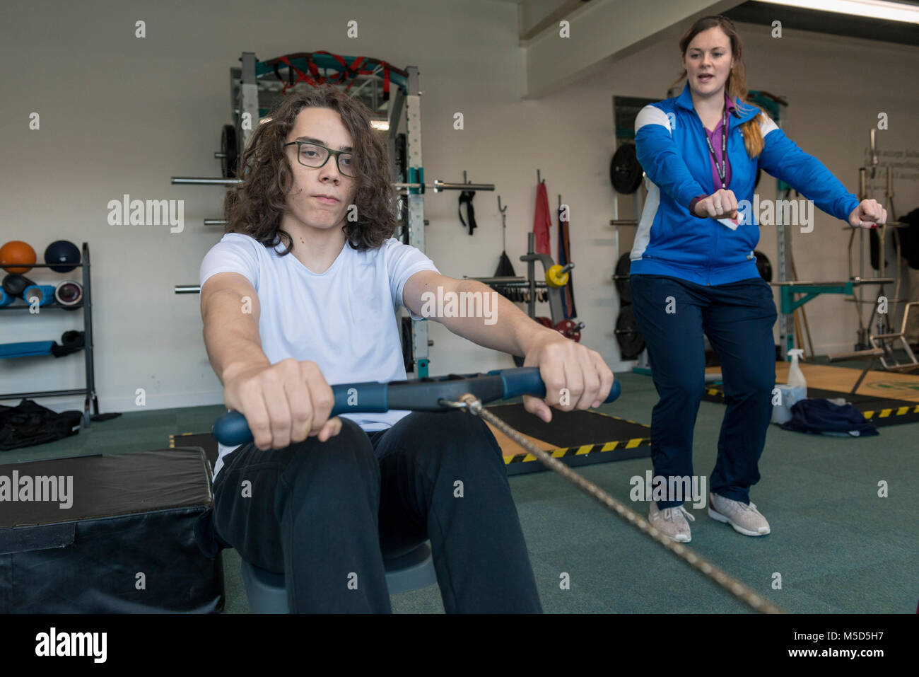 students work out and train in a gym during a lesson at college Stock