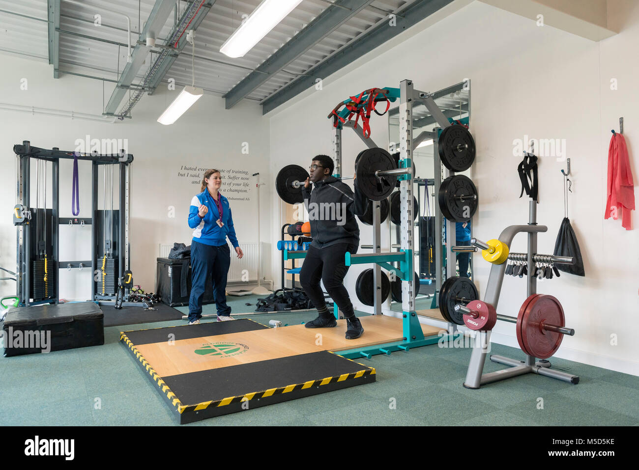 students work out and train in a gym during a lesson at college Stock Photo