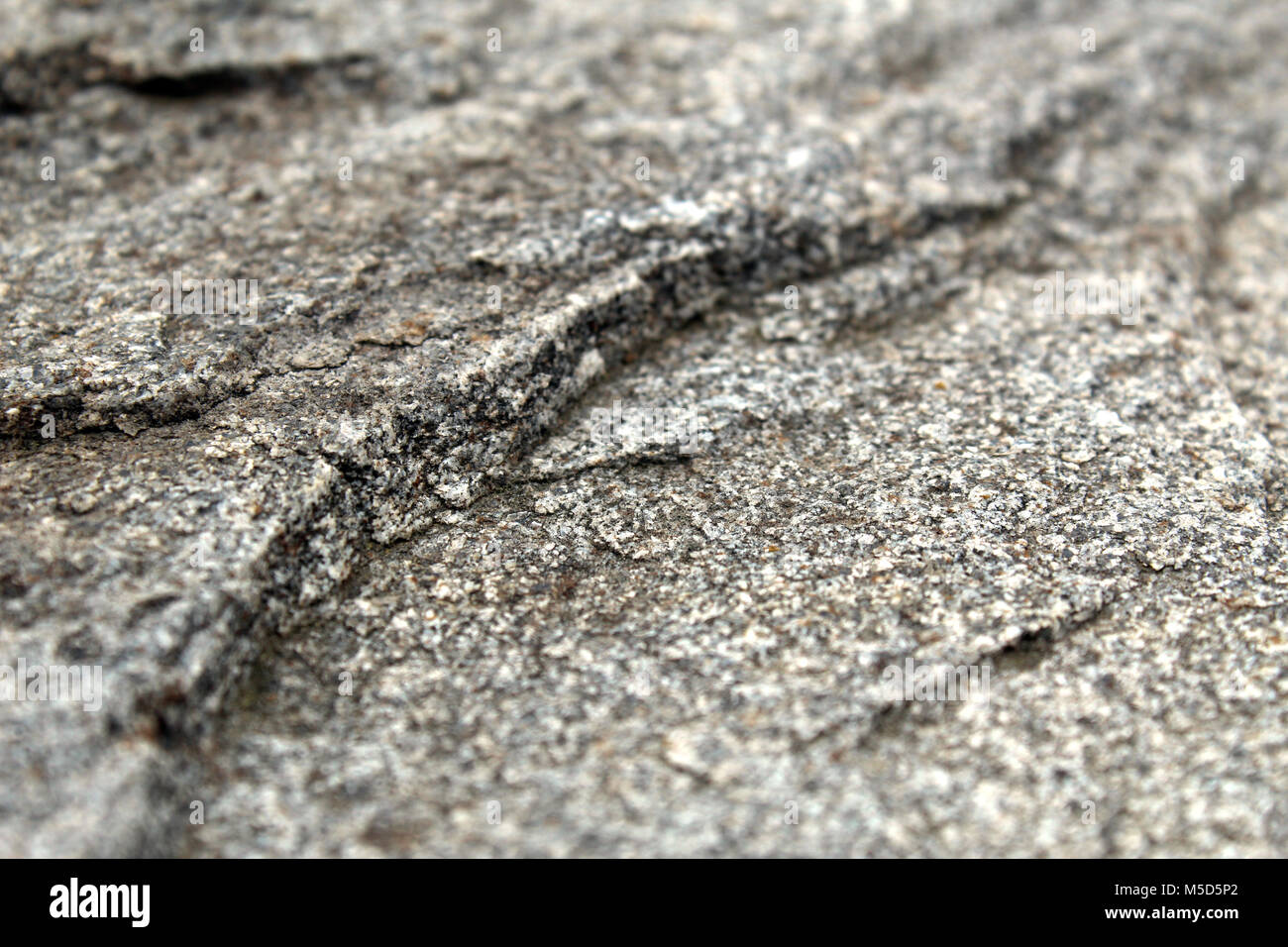Fine-grained rough rock surface seen in detail Stock Photo