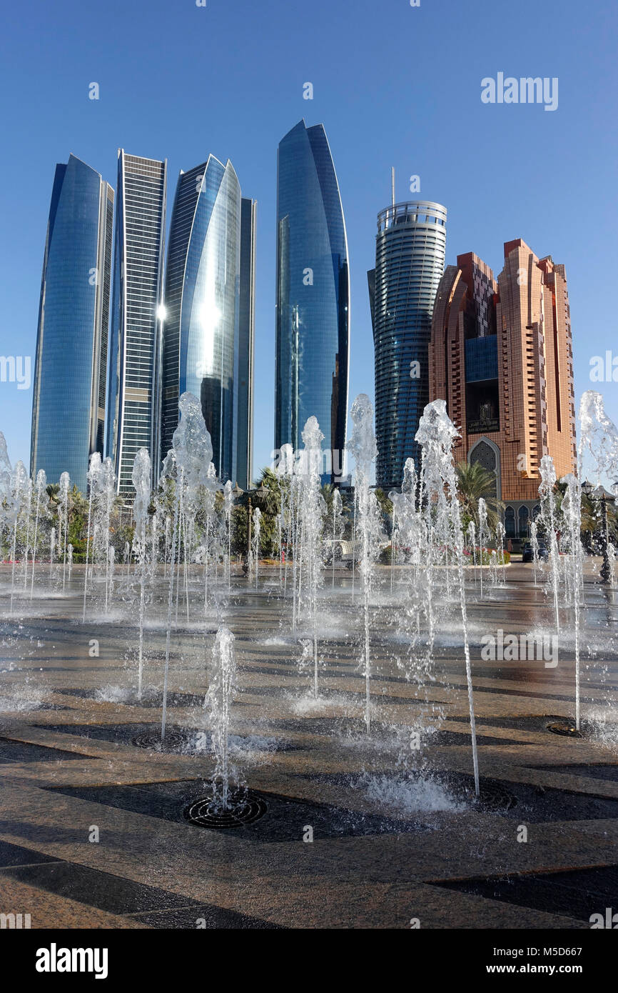 Trick fountains in front of skyscrapers, Abu Dhabi, United Arab Emirates Stock Photo