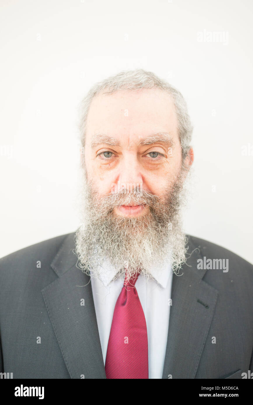 Staring Rabbi a rabbi stands in a synagogue for a portrait Stock Photo - Alamy