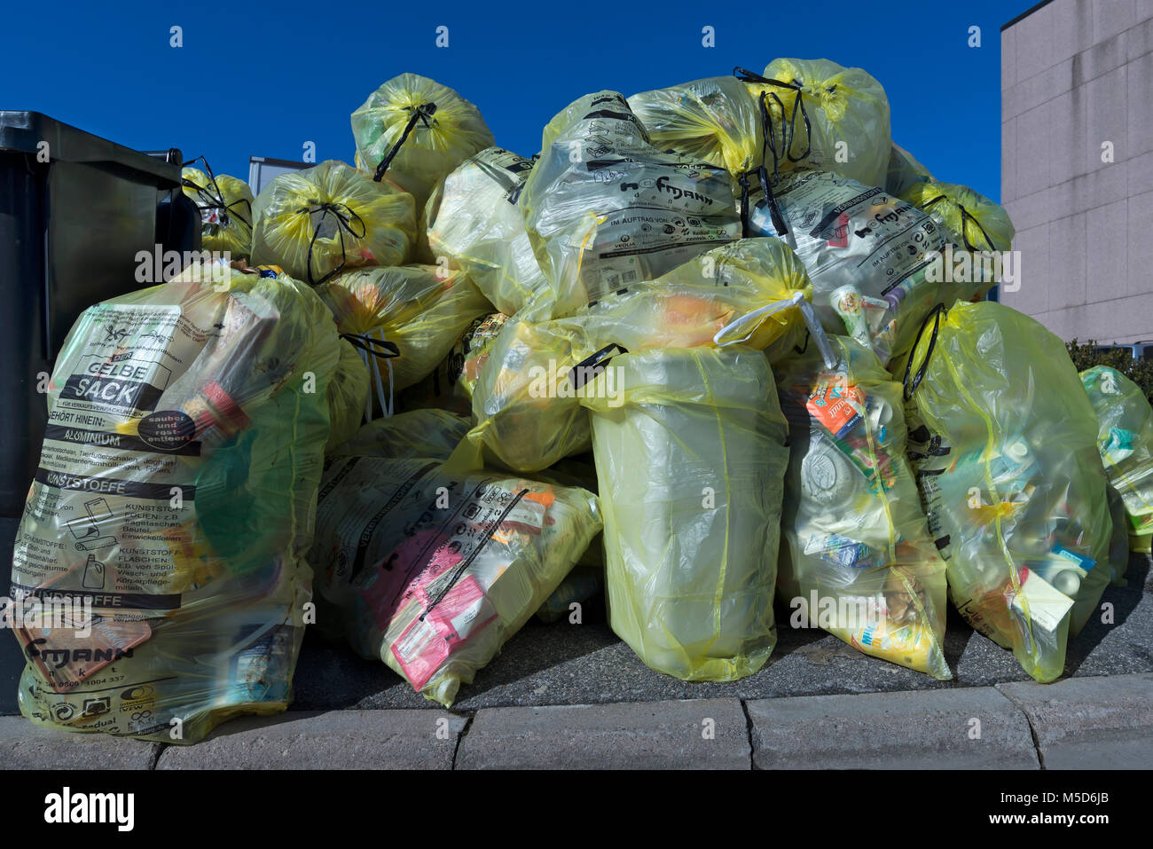Garbage bags, yellow bags for collection at the street, Bavaria, Germany Stock Photo