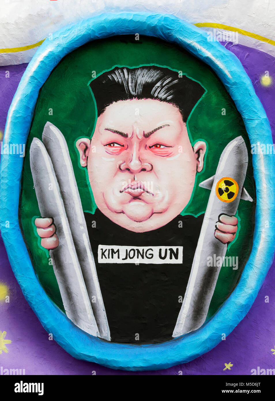 North Vietnamese President Kim Jong-un holds nuclear missile, political caricature, motto caravan during Carnival Monday Stock Photo