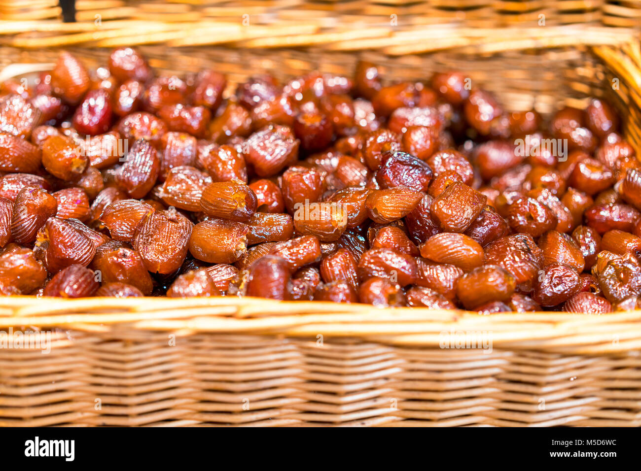 Dates fruit. Pile of fresh dried date fruits in a basket. Fresh healthy
