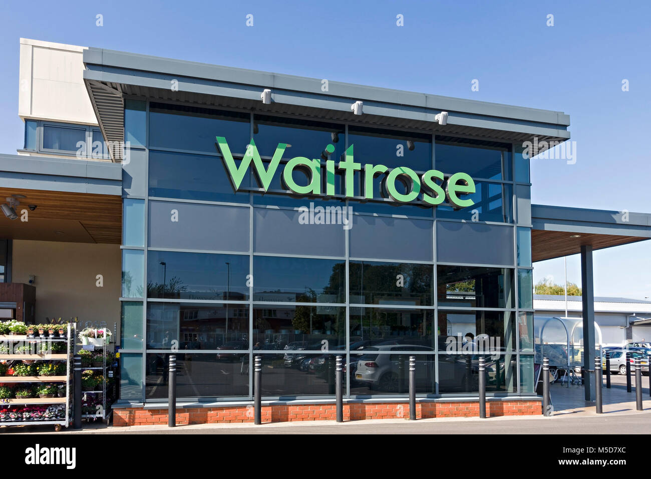 Waitrose logo on front of supermarket in Market Harborough, Leicestershire, England, UK Stock Photo