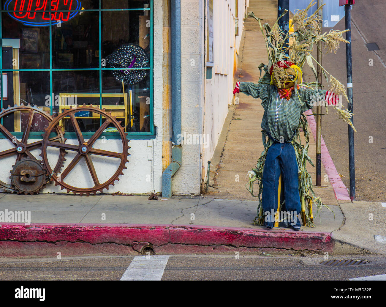 Halloween Scarecrow On Corner In Small Town Stock Photo