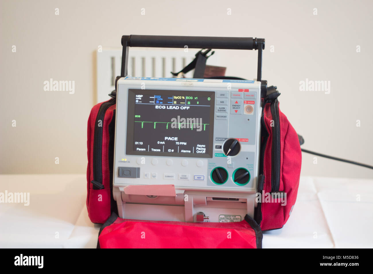 Zoll CCT Defibrillator equipment in red carrying case for cardiac arrest, ECG, AED Stock Photo
