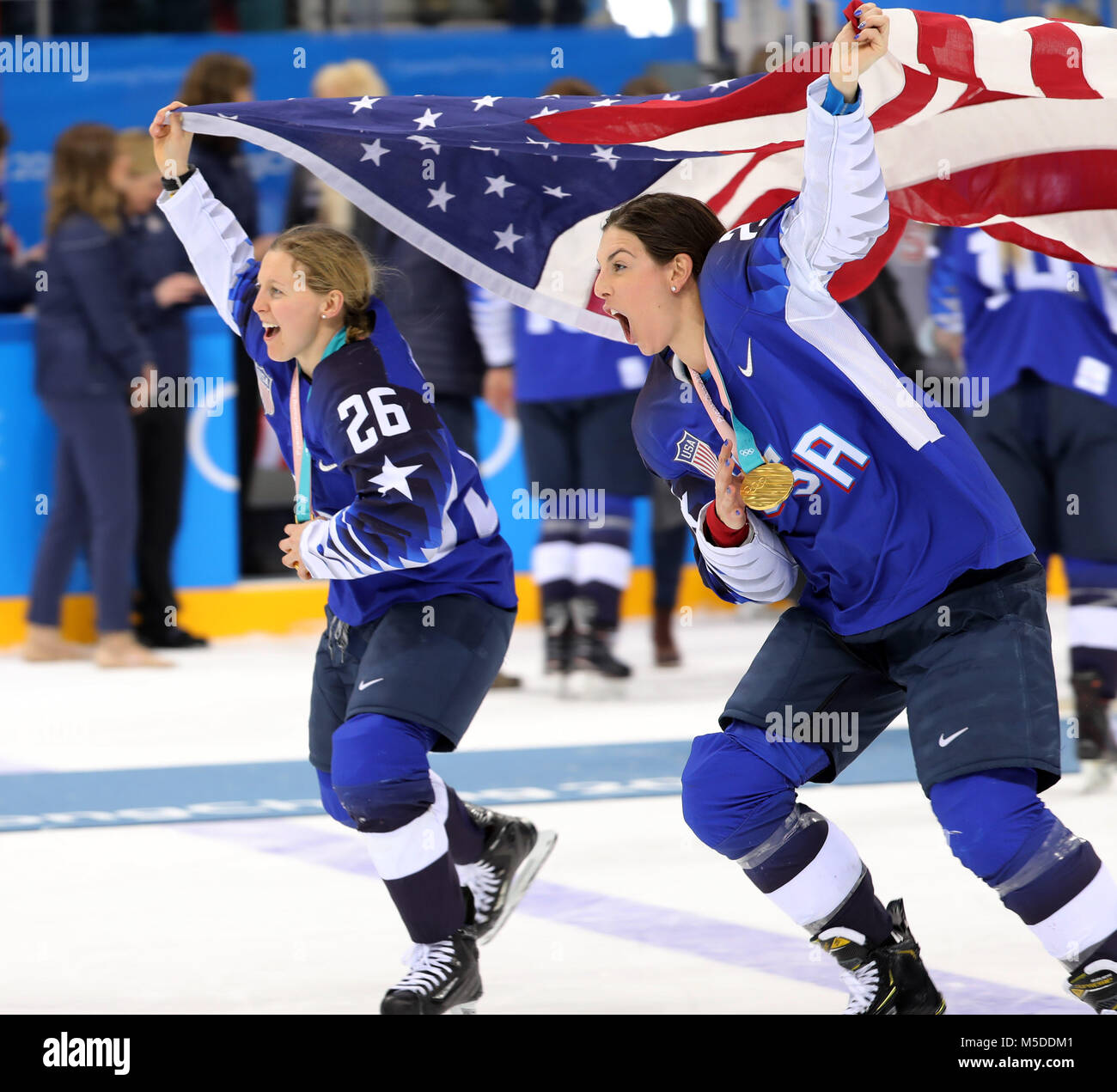 February 22, 2018 - Gangneung, South Korea - KENDALL COYNE and her partner  MICHAEL SCHOFIELD celebrate with the USA team after winning the Ice Hockey:  Women's Gold Medal Game against Canada at
