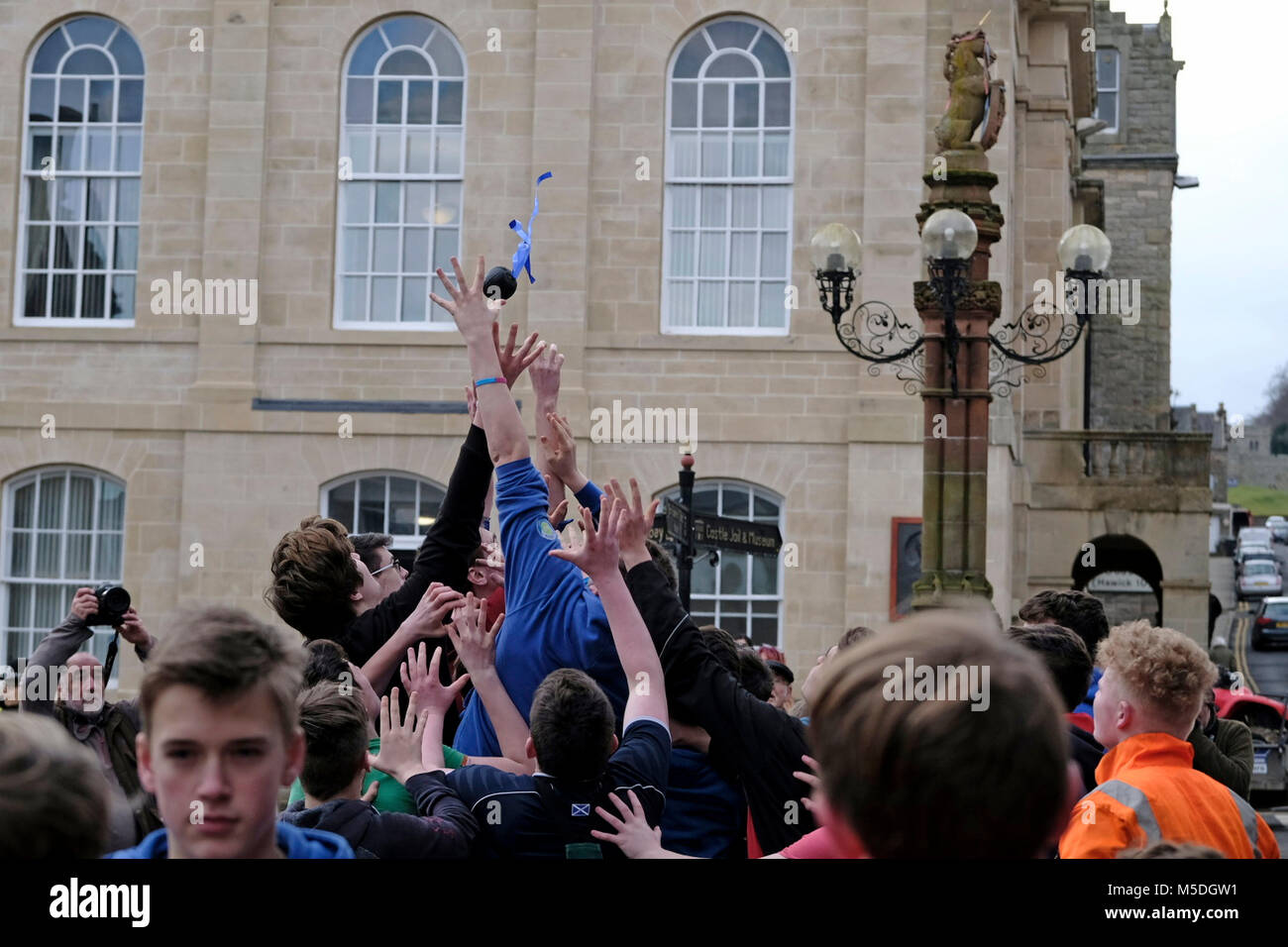 Jedburgh, Mercat Cross, UK. 22nd Feb, 2018. Jed Hand Ba' The annual game of hand ball takes place every year the Thursday after Fastern's E'en. The tradition derives from 1548 when a party of Scots recaptured Ferniehirst Castle, a mile south of Jedburgh and used an Englishman's head in a celebratory game after the battle. ( Credit: Rob Gray/Alamy Live News Stock Photo