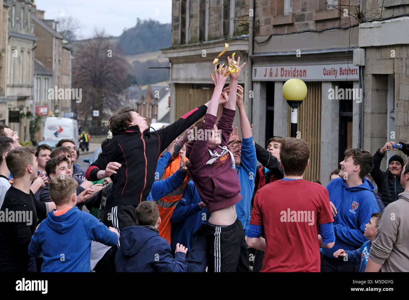 Jedburgh, Mercat Cross, UK. 22nd Feb, 2018. Jed Hand Ba' The annual game of hand ba' takes place every year the Thursday after Fastern's E'en. The tradition derives from 1548 when a party of Scots recaptured Ferniehirst Castle, a mile south of Jedburgh and used an Englishman's head in a celebratory game after the battle. ( Credit: Rob Gray/Alamy Live News Stock Photo