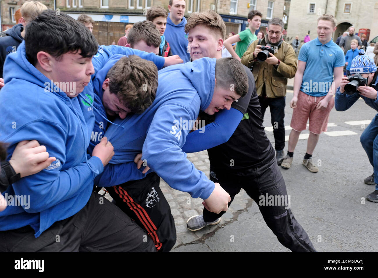 Jedburgh, Mercat Cross, UK. 22nd Feb, 2018. Jed Hand Ba' The annual game of hand ba' takes place every year the Thursday after Fastern's E'en. The tradition derives from 1548 when a party of Scots recaptured Ferniehirst Castle, a mile south of Jedburgh and used an Englishman's head in a celebratory game after the battle. ( Credit: Rob Gray/Alamy Live News Stock Photo